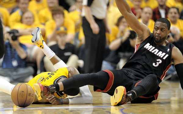 Paul George went down Tuesday night after getting hit in the head by Dwyane Wade's knee. (Sun Sentinel/Getty Images)